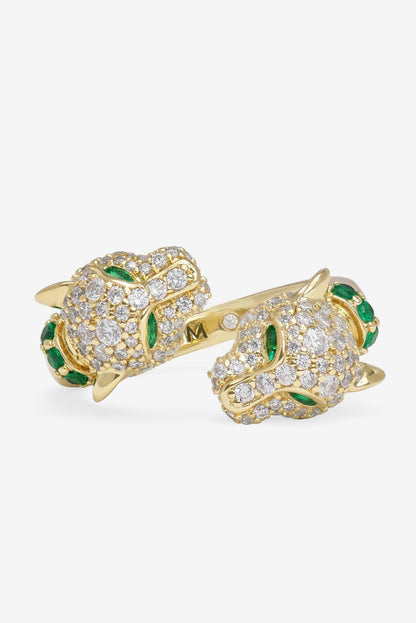 Gold pavé ring with clear stones, green accents, engraved M detail