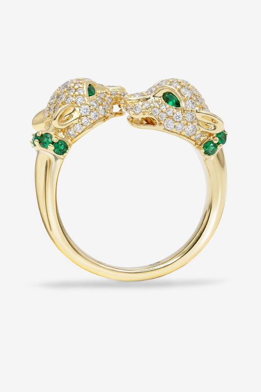 Gold pavé ring with clear stones and green gemstone accents