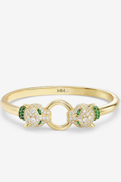 Gold cuff bracelet with clear pavé crystals and green stone accents, linked double loop