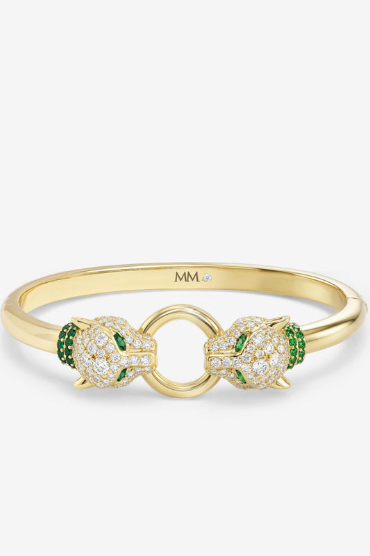 Gold cuff bracelet with clear pavé crystals and green stone accents, linked double loop