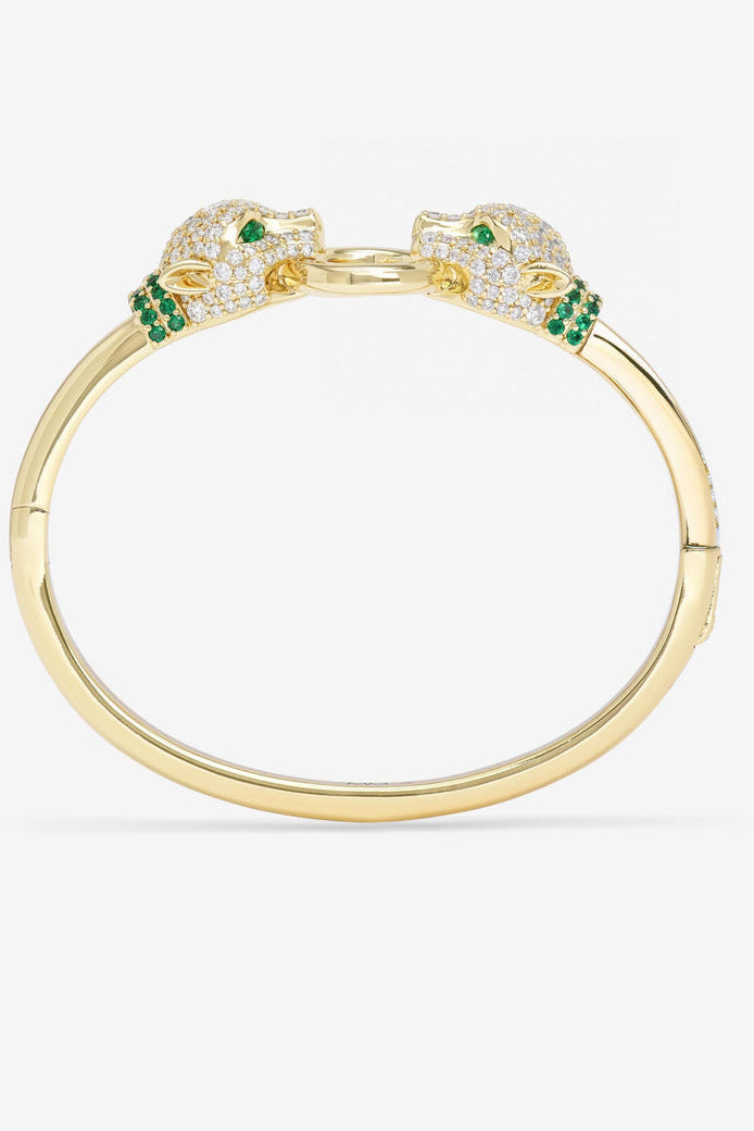 Gold open cuff bracelet with crystal pavé details and green stone accents