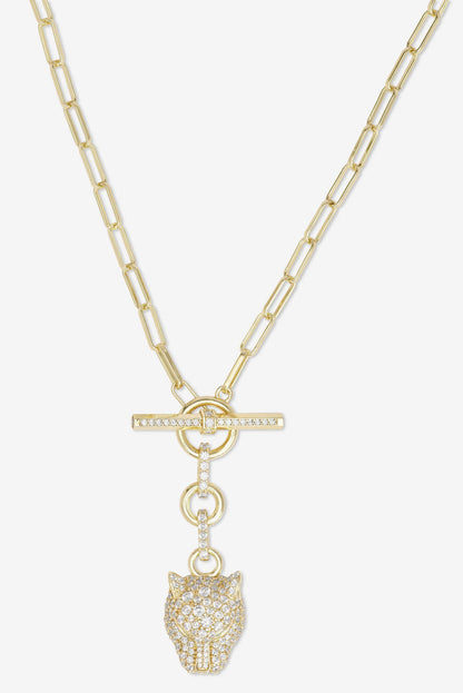 Gold tone chain necklace with bar clasp and dangling jaguar head charm