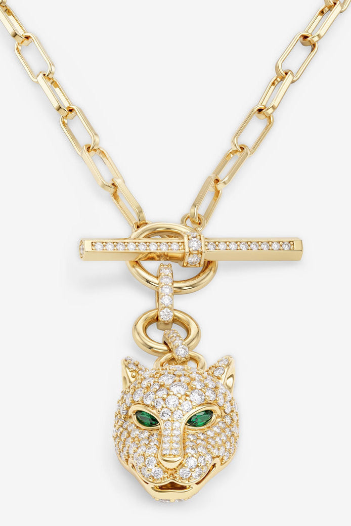 Gold tone chain necklace with crossbar ring clasp and sparkling jaguar head charm