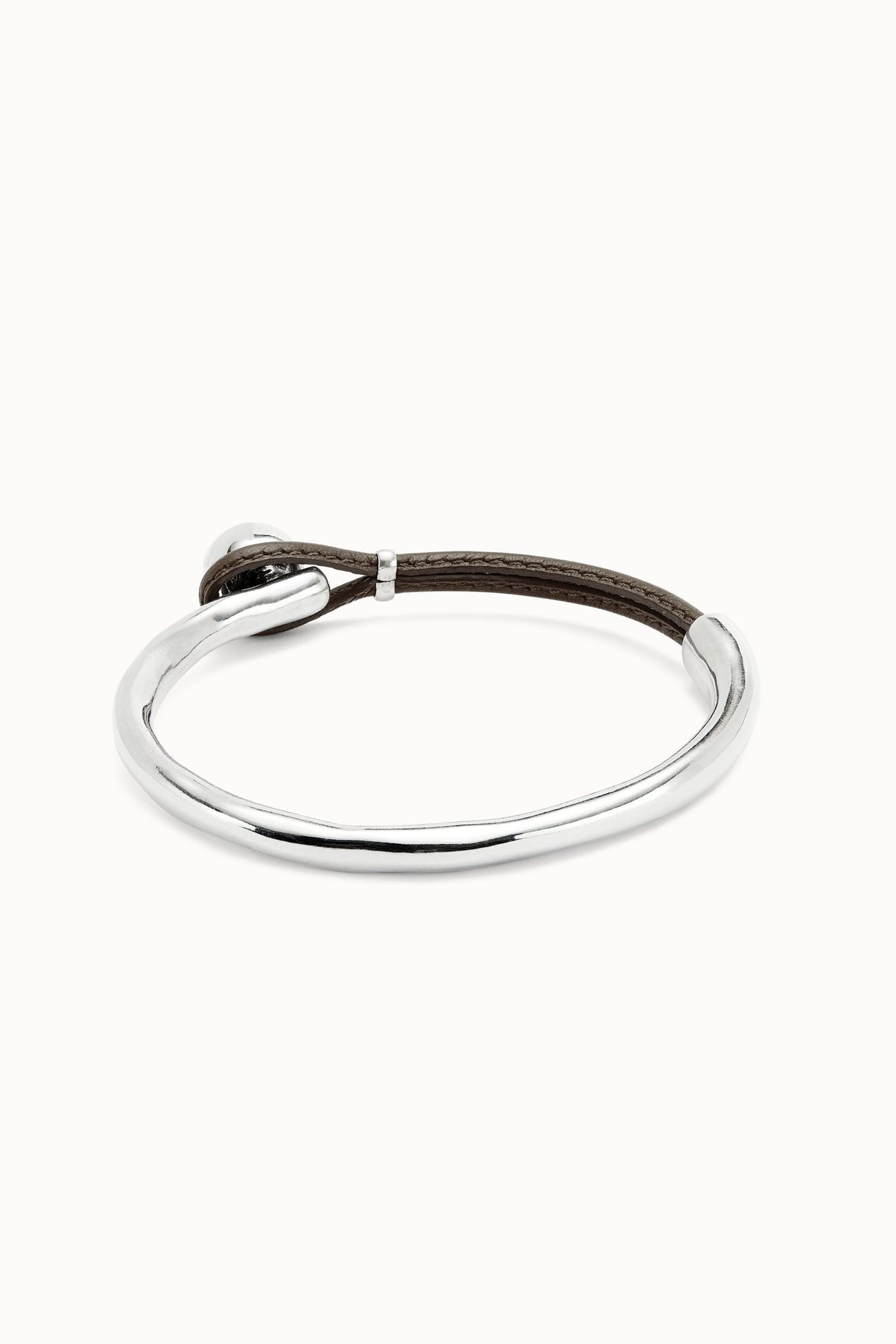 SER Intrepida bracelet, silver metal loop with dark leather detail near clasp