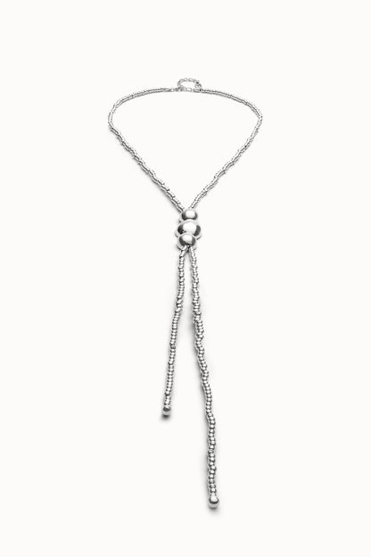 Silver heart-shaped pendant necklace with bead tassel and small clasp