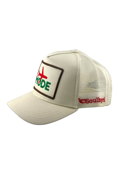 Cream trucker cap with MODE front patch and side embroidered logo