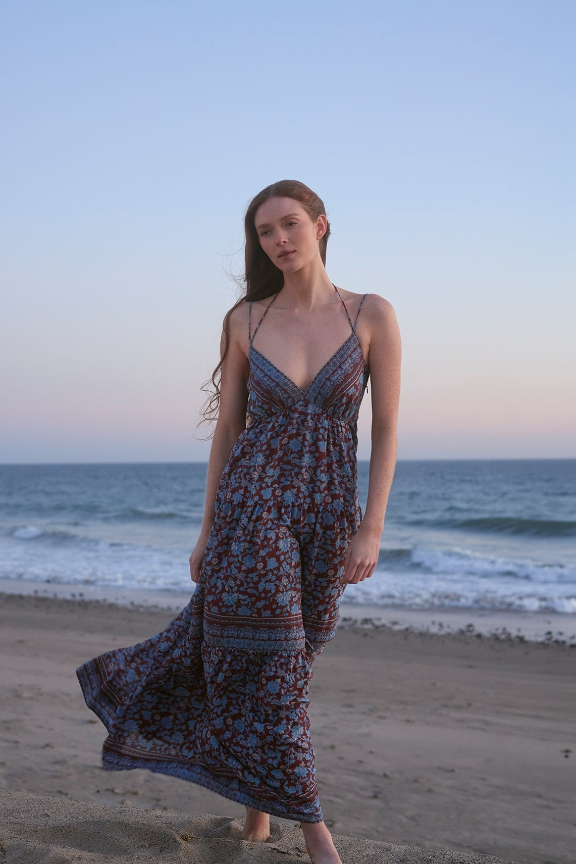 Tiered maxi dress with blue border print, spaghetti straps and V-neck