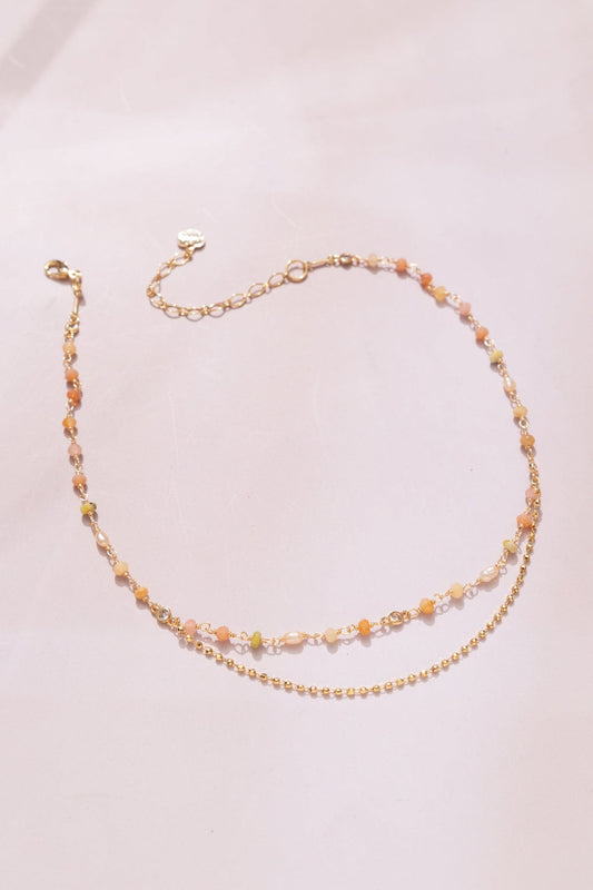 Two-layer beaded necklace with peach multi beads and gold-tone chain links
