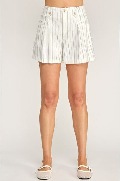 White pinstripe shorts worn by a person on a plain background