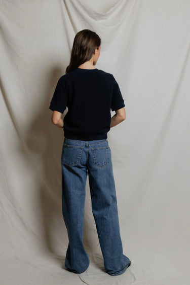 Women's navy fleece short-sleeve crewneck top, back view