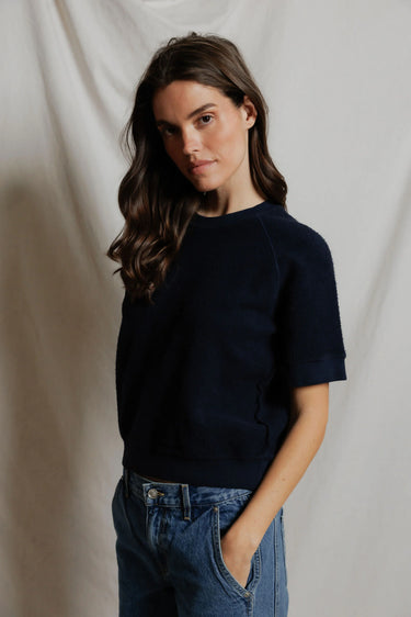 Women's navy fleece short-sleeve crewneck top, front close-up