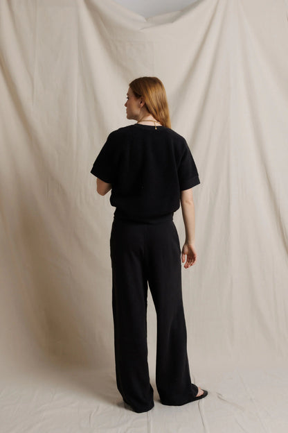 Black fleece short-sleeve sweatshirt set, back view with wide-leg pants