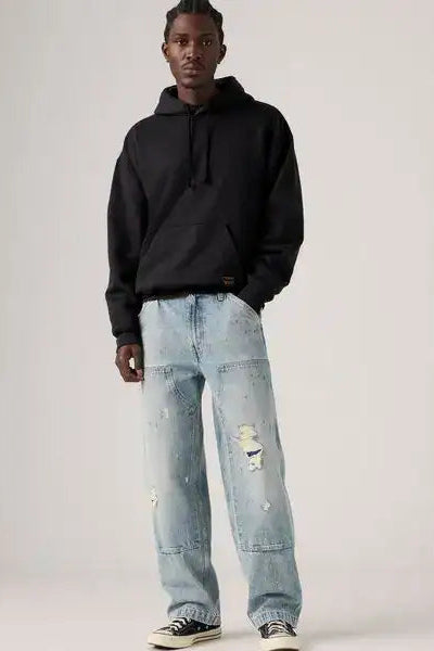 568 loose double knee distressed denim in diving ducks front view
