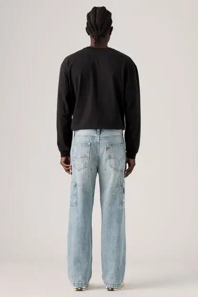 568 loose double knee distressed denim in diving ducks back view