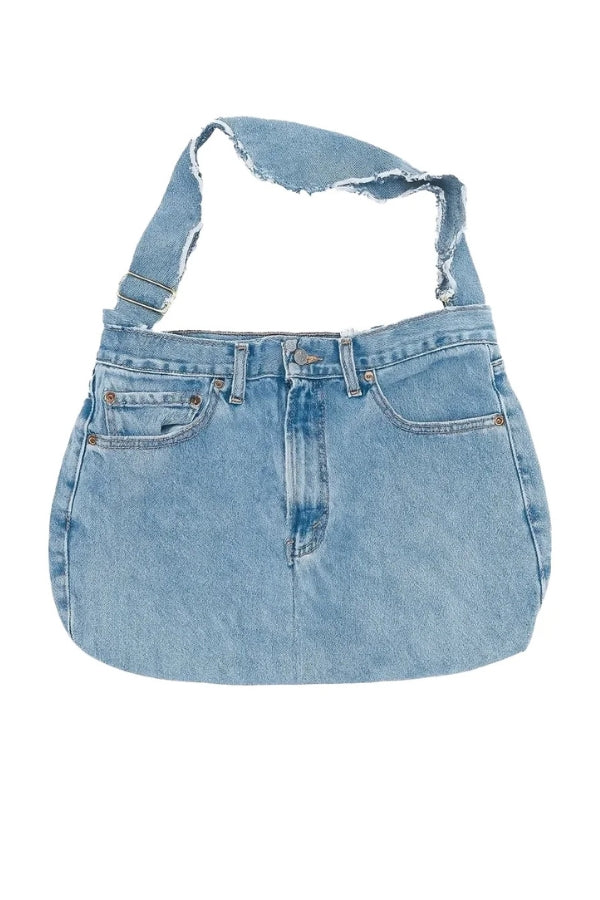 Denim bag with shoulder straps on a white background