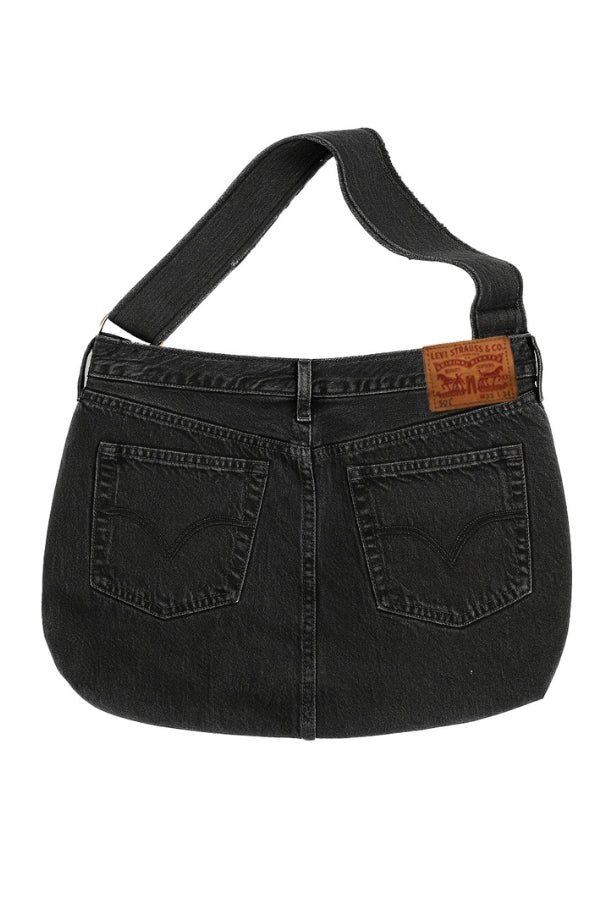 Black denim handbag with a visible brand label on a white background