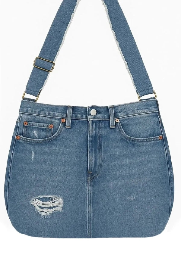 Blue denim bag with a strap on a white background