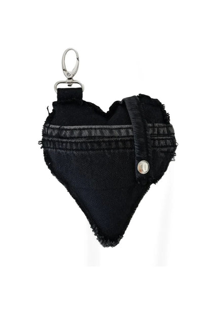 Black heart-shaped keychain with frayed edges on a white background