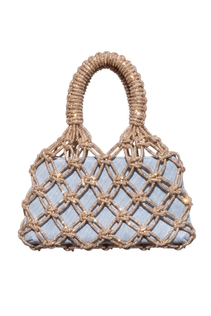 Woven handbag with a light denim blue fabric interior on a white background