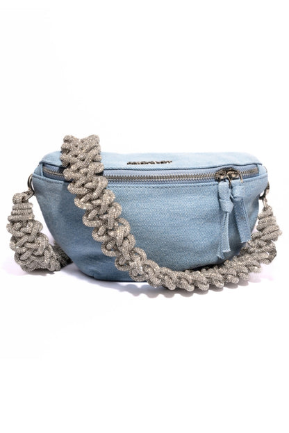 Blue denim fanny pack with a braided strap on a white background