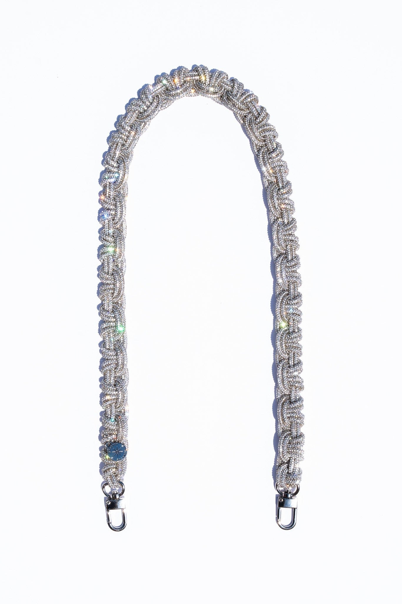 Decorative bag strap with crystals on a white background