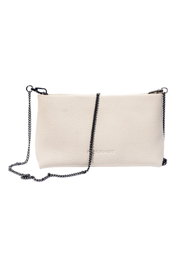 Beige clutch bag with black chain strap on a white background