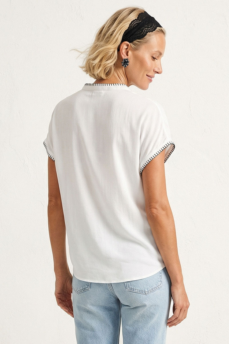 Off-white drop-shoulder blouse back view with short sleeves and whipstitch edging