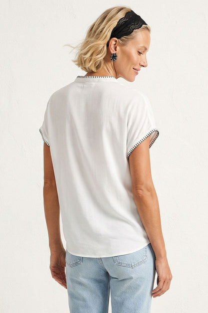 Off-white drop-shoulder blouse back view with short sleeves and whipstitch edging