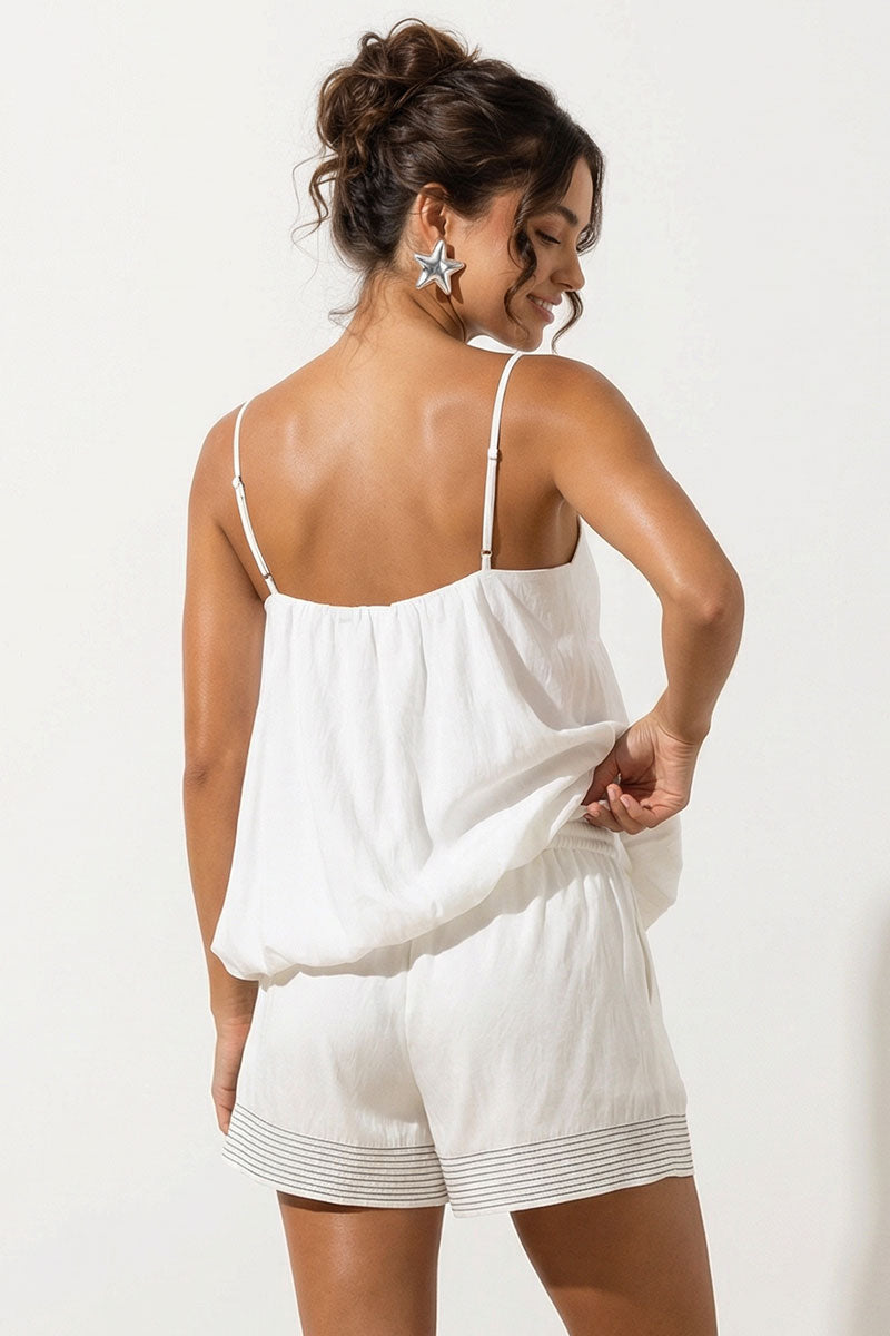 White bubble hem cami top with thin spaghetti straps and open back