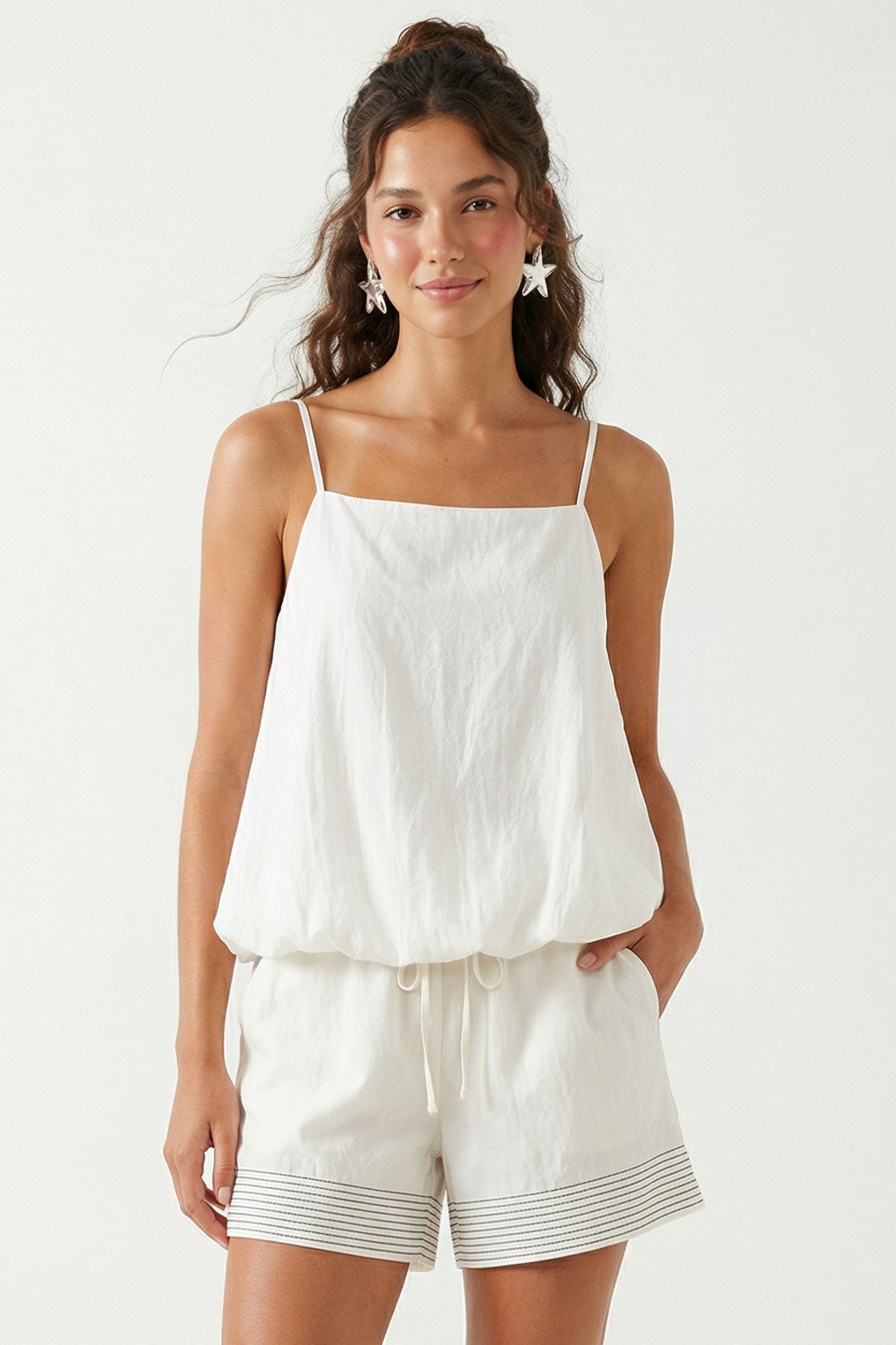 White bubble hem cami top with thin spaghetti straps and square neckline
