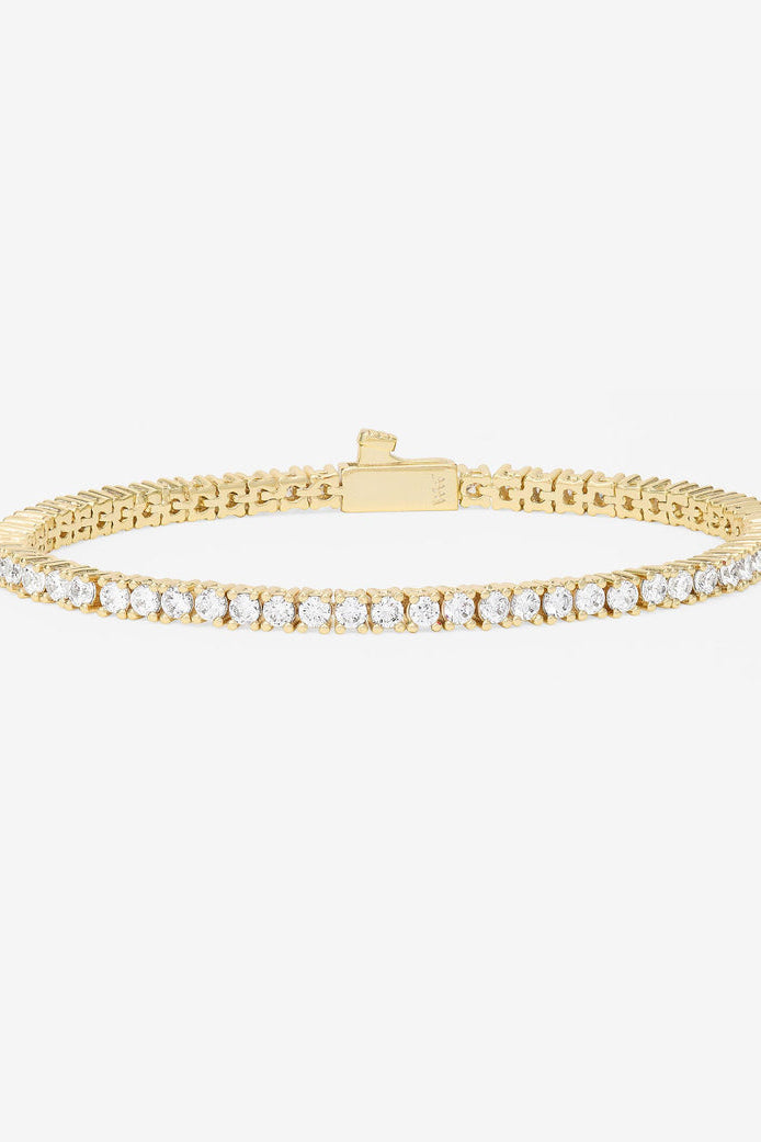 Gold-tone tennis bracelet with row of white pavé stones