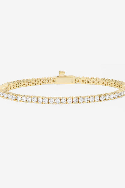 Gold-tone tennis bracelet with row of white pavé stones