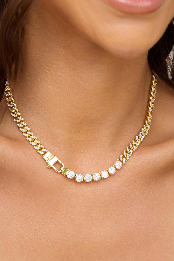 Gold-tone tennis necklace with white stones and square link clasp
