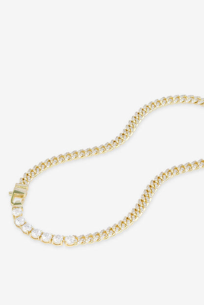 Gold-tone tennis necklace with white pavé stones and square link clasp