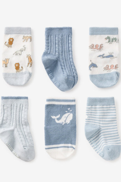 Six baby socks in light blue and white, featuring animals, stripes, and ribbed cuffs