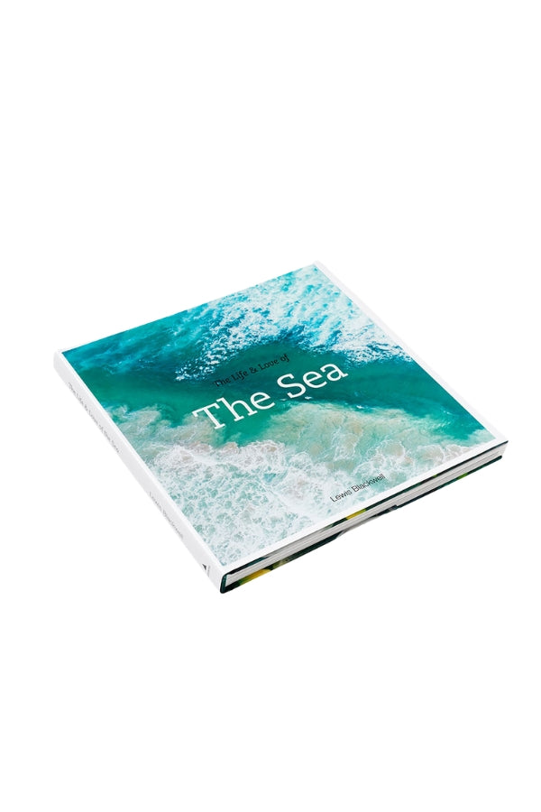 Sea photo book angled with turquoise water cover and 'the sea' title