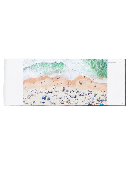 Coastal wall art print with turquoise surf over sandy shoreline, small beach details