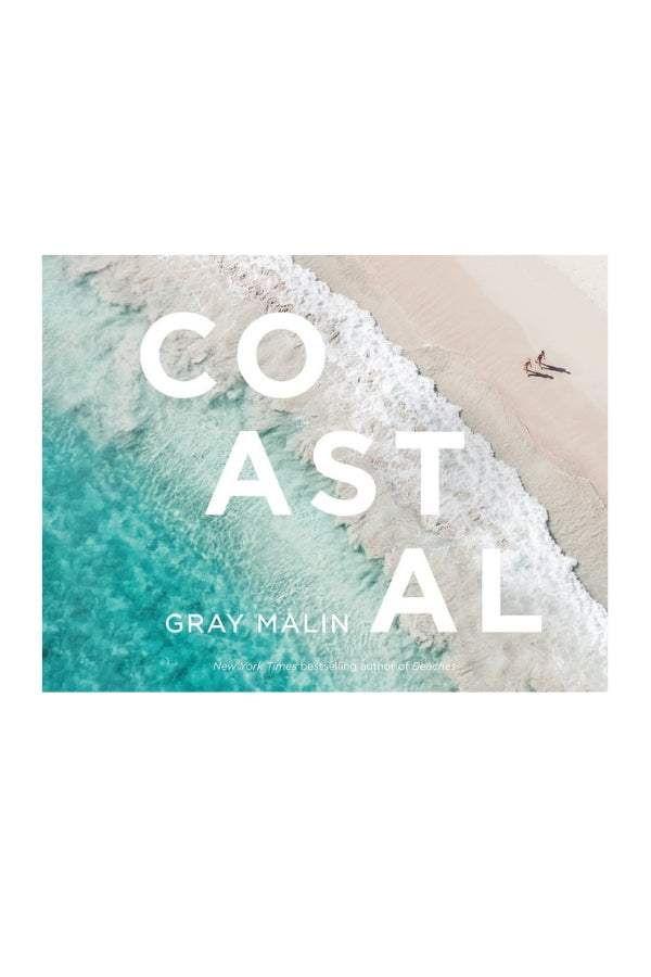 Coastal wall art print with turquoise waves and sandy beach, white text overlay