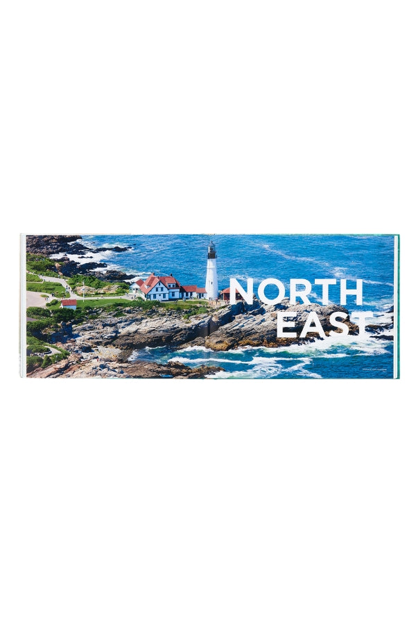 Coastal wall art print with lighthouse on rocky shoreline, ocean waves and text overlay