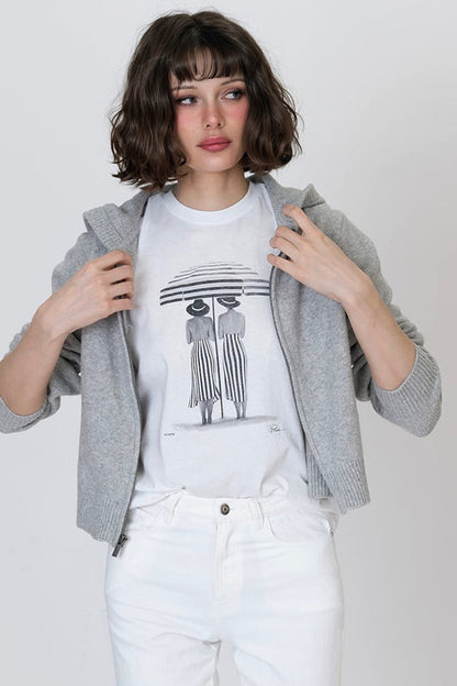 Shade Mushie tee, worn white, front graphic of two people beneath striped canopy