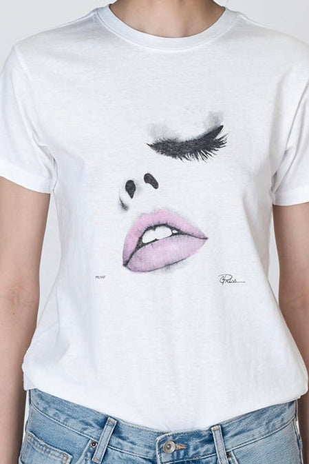White T-shirt with close-up eyelashes and lips graphic on chest
