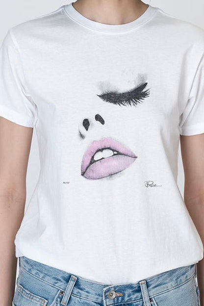 White T-shirt with close-up eyelashes and lips graphic on chest