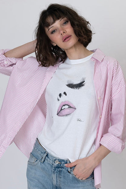 White graphic crewneck tee with eyelashes and lips print, front view