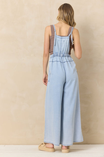 Back view of denim tencel wide leg jumpsuit