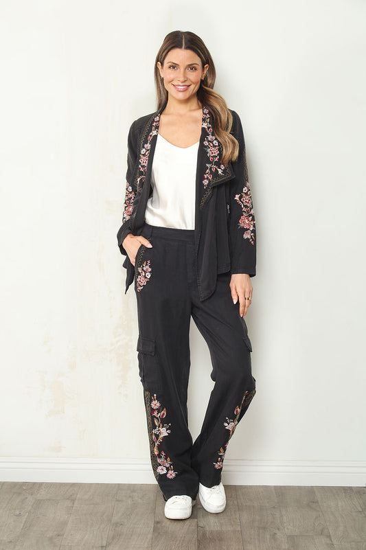 Black pull-on cargo pants with floral embroidery at pockets and side seams