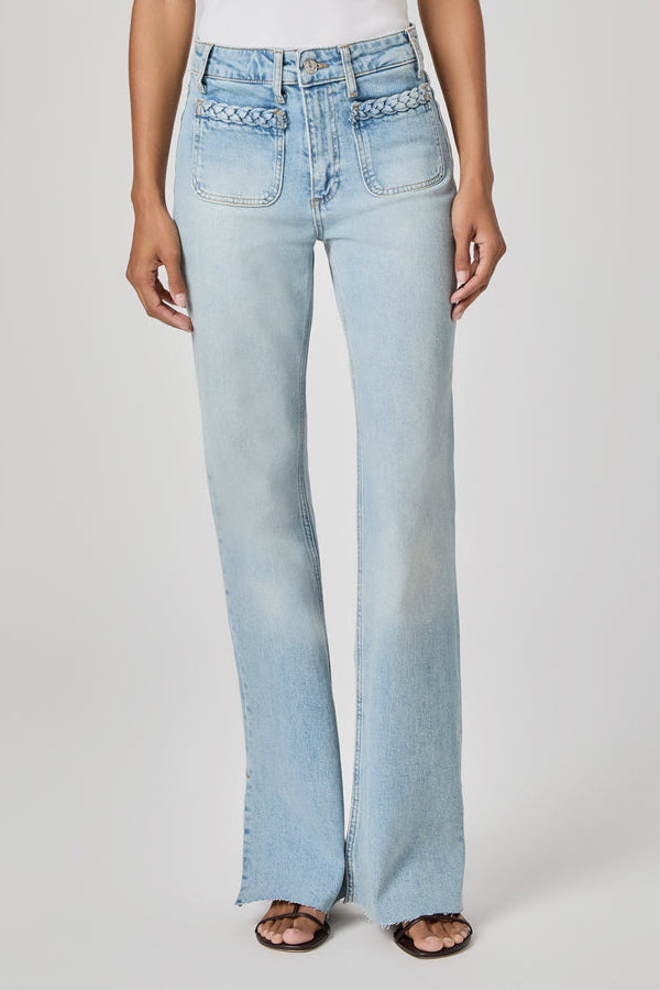 Light blue flared sofia jeans in montebello worn by a person on a white background