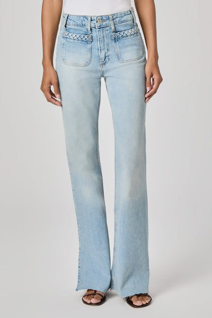 Light blue flared sofia jeans in montebello worn by a person on a white background