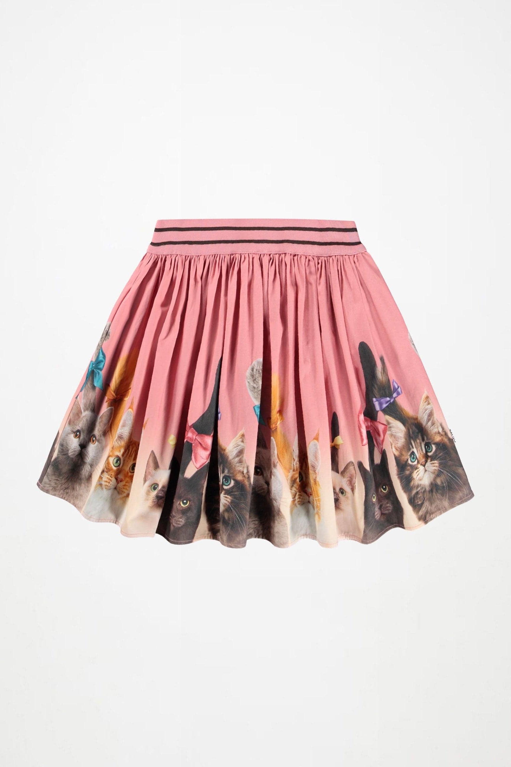 A pink pleated mini skirt featuring a printed pattern of various cat faces around the hem, with a matching pink elastic waistband accented by thin black stripes.