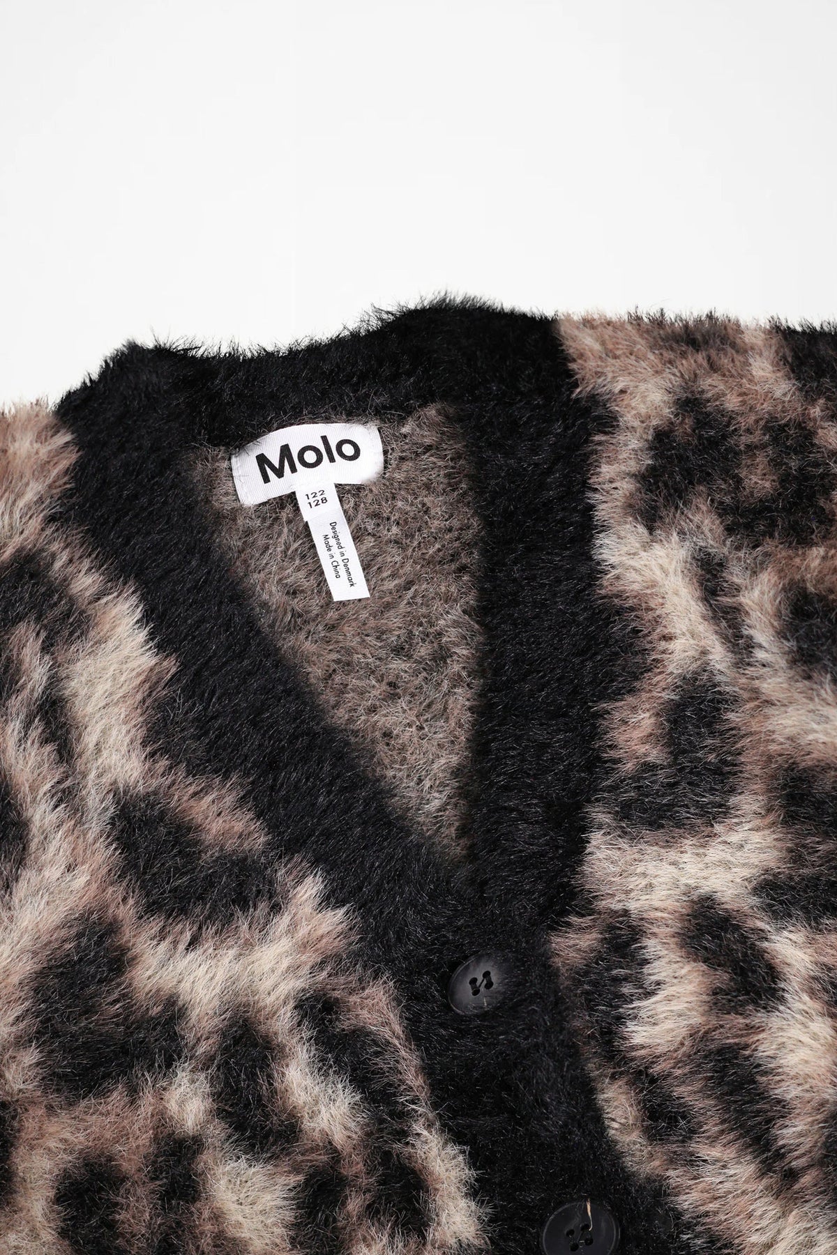 Leopard-print cardigan front with black buttons and deep V neckline