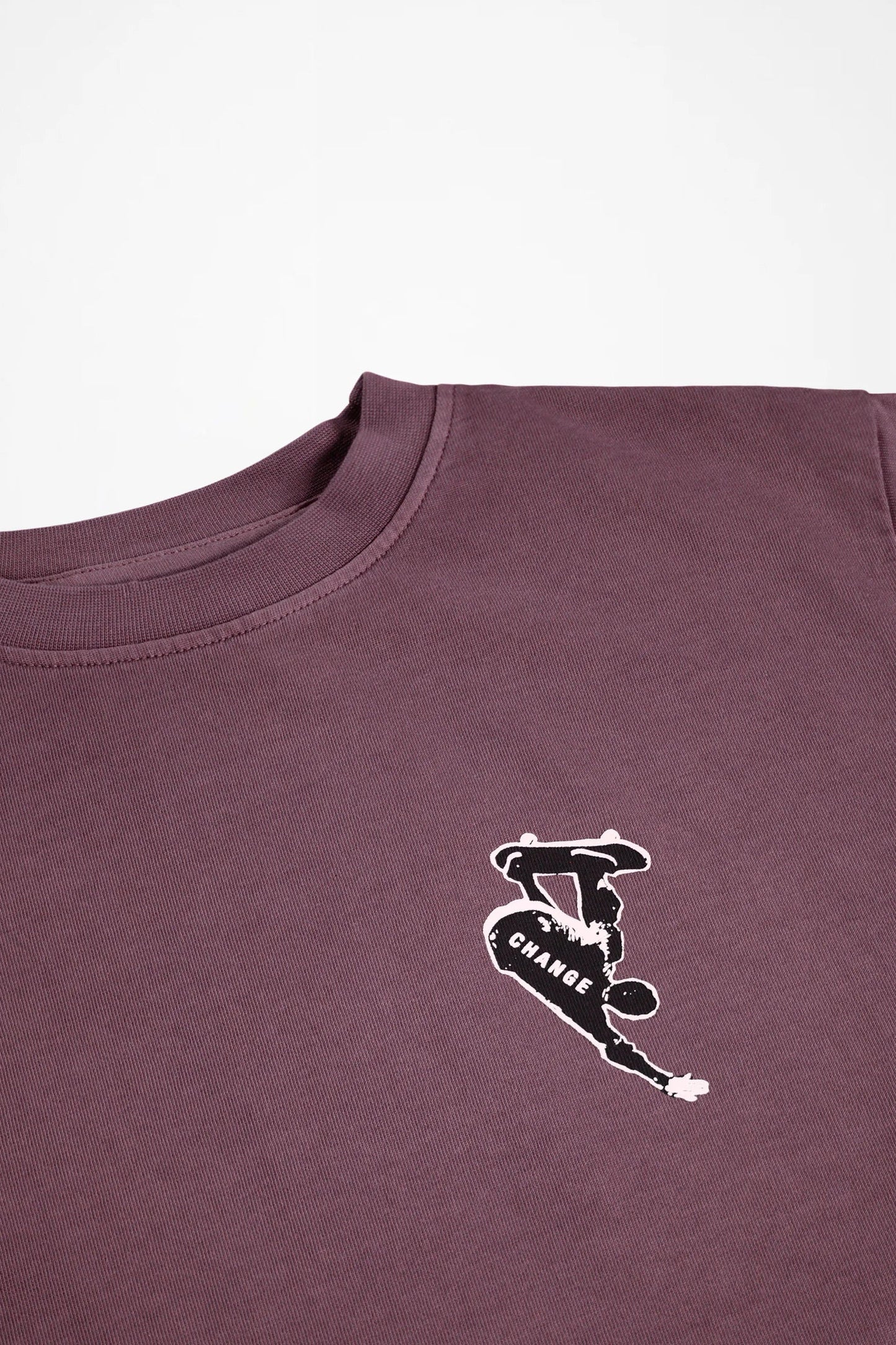 Kids long-sleeve crewneck shirt close-up of small chest logo graphic in dark purple